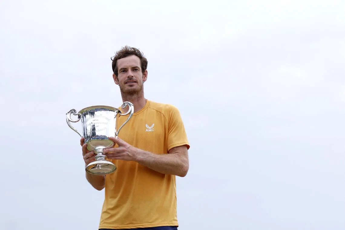 Britain's Andy Murray celebrates with the trophy after winning the final match against Austria's Jurij Rodionov.