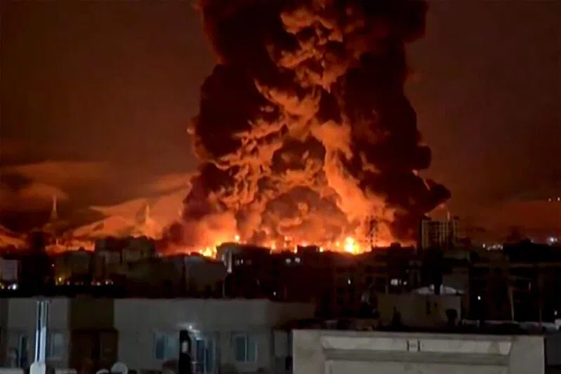 A video grab from social media on March 7 and 8 showing fire erupting at an oil depot in Iran's capital Tehran.
