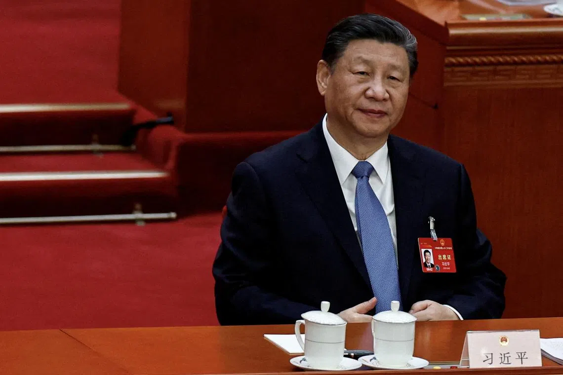 FILE PHOTO: Chinese President Xi Jinping attends the second plenary session of the National People's Congress (NPC) at the Great Hall of the People in Beijing, China March 8, 2024. REUTERS/Tingshu Wang/File Photo