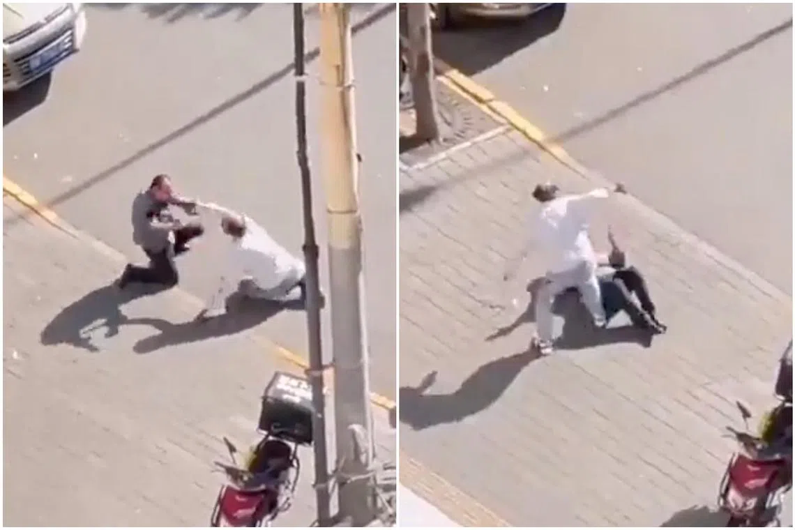 A video circulating on X shows a man dressed in white wrestling on a sidewalk with a middle-aged man.