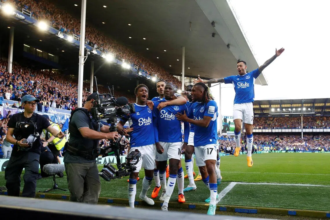Everton's Abdoulaye Doucoure celebrating with Conor Coady, Demarai Gray and Alex Iwobi after scoring the winner in a 1-0 success over Bournemouth on Sunday that kept them in the Premier League.
