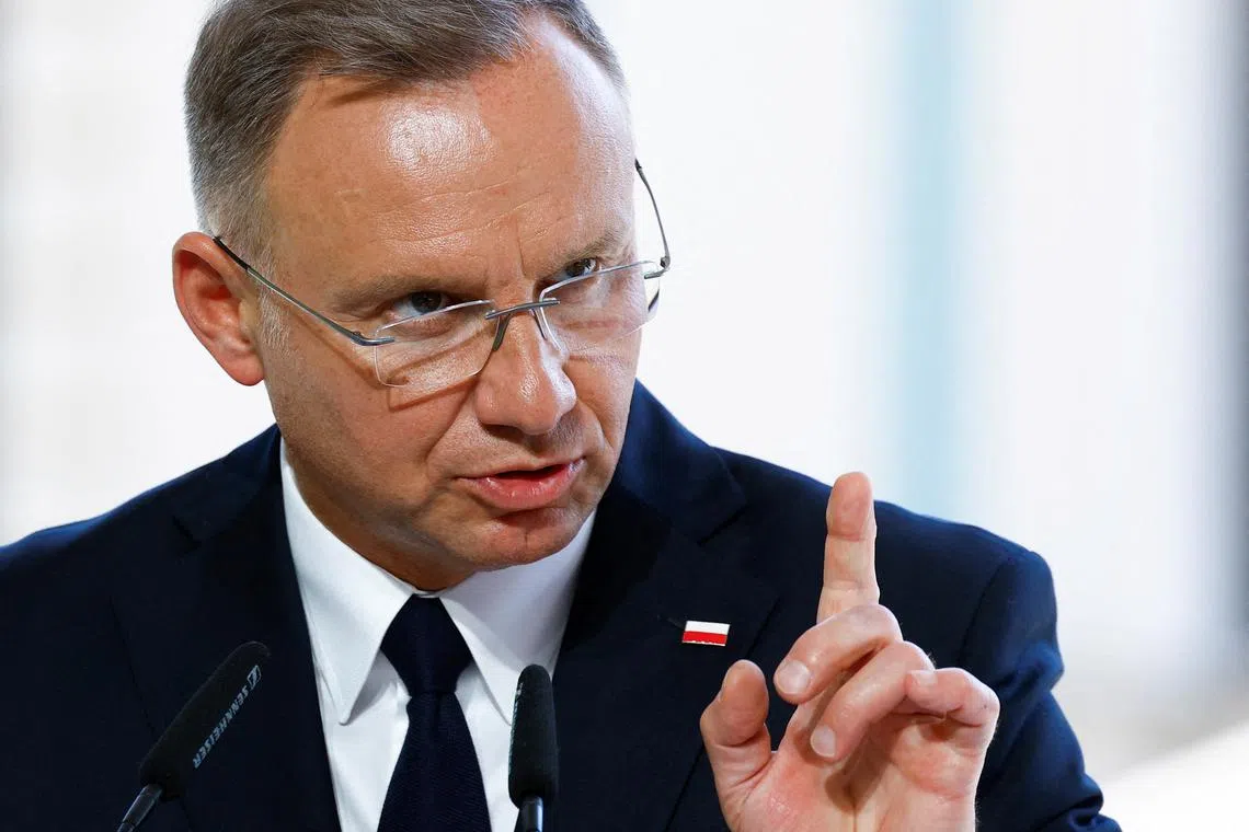 FILE PHOTO: Polish President Andrzej Duda speaks during a joint press conference with Ukraine's President Volodymyr Zelenskiy and Lithuanian Prime Minister Ingrida Simonyte (not pictured), in Kyiv, Ukraine August 24, 2024. REUTERS/Valentyn Ogirenko/File Photo