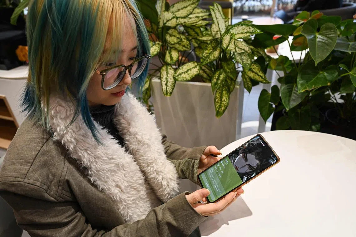 Ms Wang Xiuting showing her virtual boyfriend on Wantalk - an artificial intelligence chatbot created by Chinese tech company Baidu.