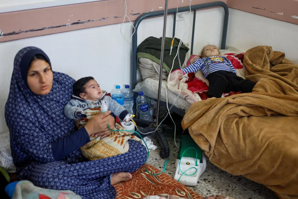 Palestinian children receive treatment at the Al-Awda health centre in Rafah on March 4, 2024.