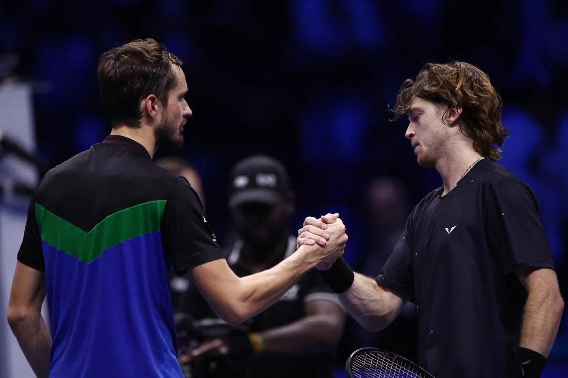 FILE PHOTO: Tennis - ATP Finals - Pala Alpitour, Turin, Italy - November 13, 2023 Russia's Daniil Medvedev shakes hands with Russia's Andrey Rublev after victory in their group stage match REUTERS/Guglielmo Mangiapane/File Photo