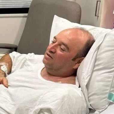 New South Wales Premier Chris Minns visiting Mr Ahmed al Ahmed at a hospital in Sydney on Dec 15.