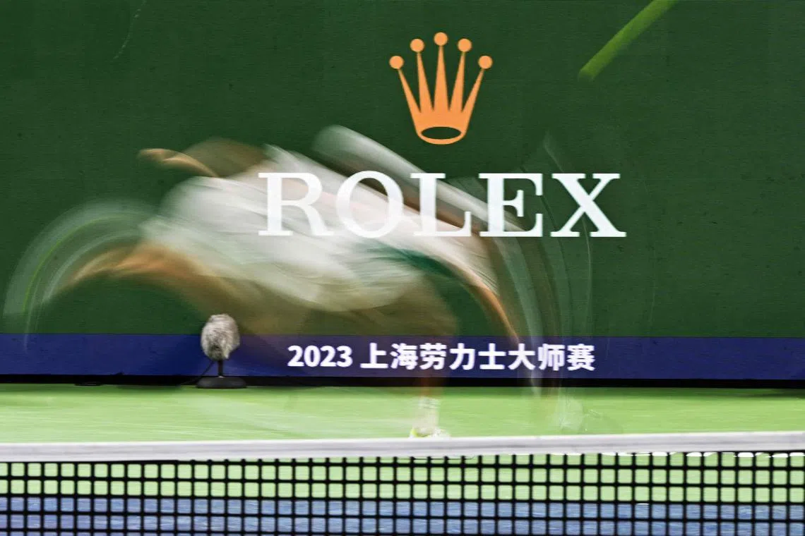 Italy's Jannik Sinner hitting a return to US's Ben Shelton in their men's singles match during the Shanghai Masters tennis tournament in Shanghai on Oct 10.