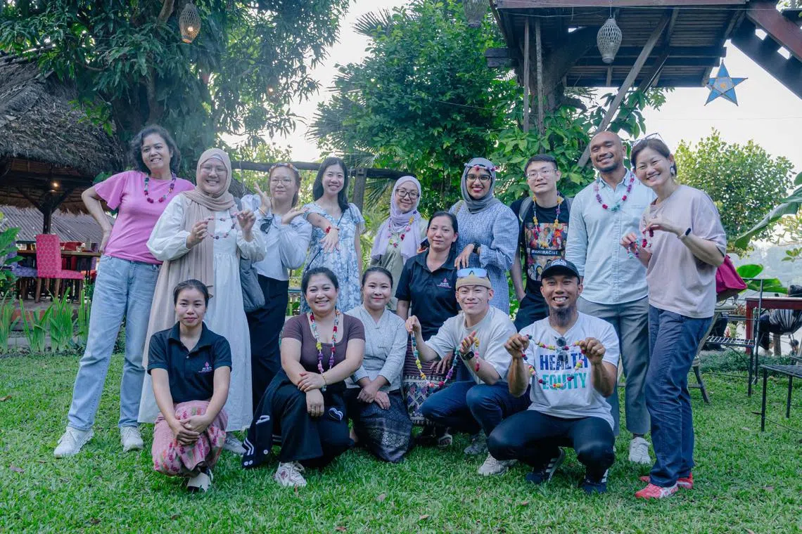 AYF fellows unwind during a cultural experience in Laos. The overseas leg to Laos helped them understand regional perspectives and forge cross-cultural bonds. 