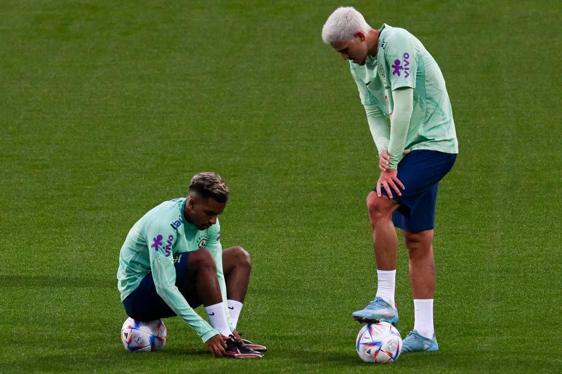 Brazil's forwards Rodrygo (left) and Pedro attend a training session on Monday at the Continassa training ground in Turin, northern Italy, as part of Brazil's preparation ahead of the Qatar 2022 World Cup.