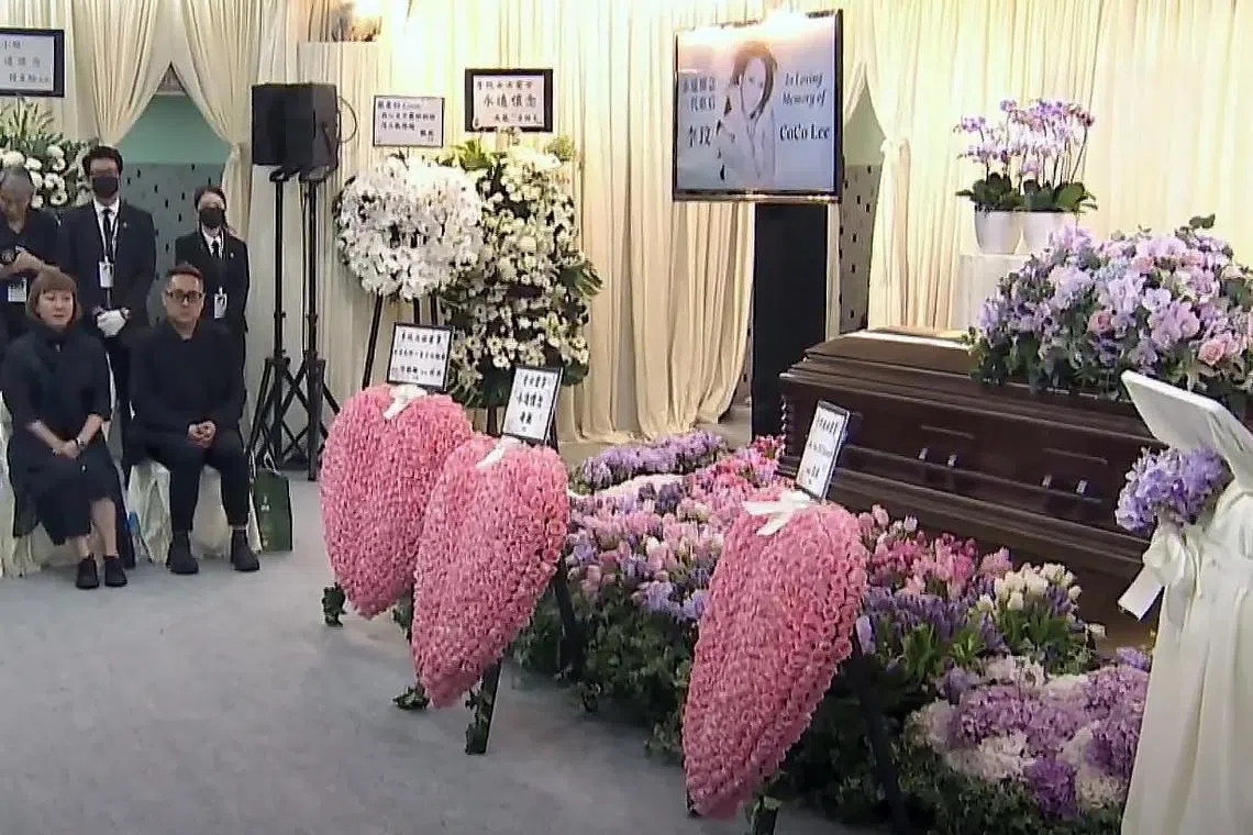 Family and friends (top) of Coco Lee at her memorial service in Hong Kong on Monday.