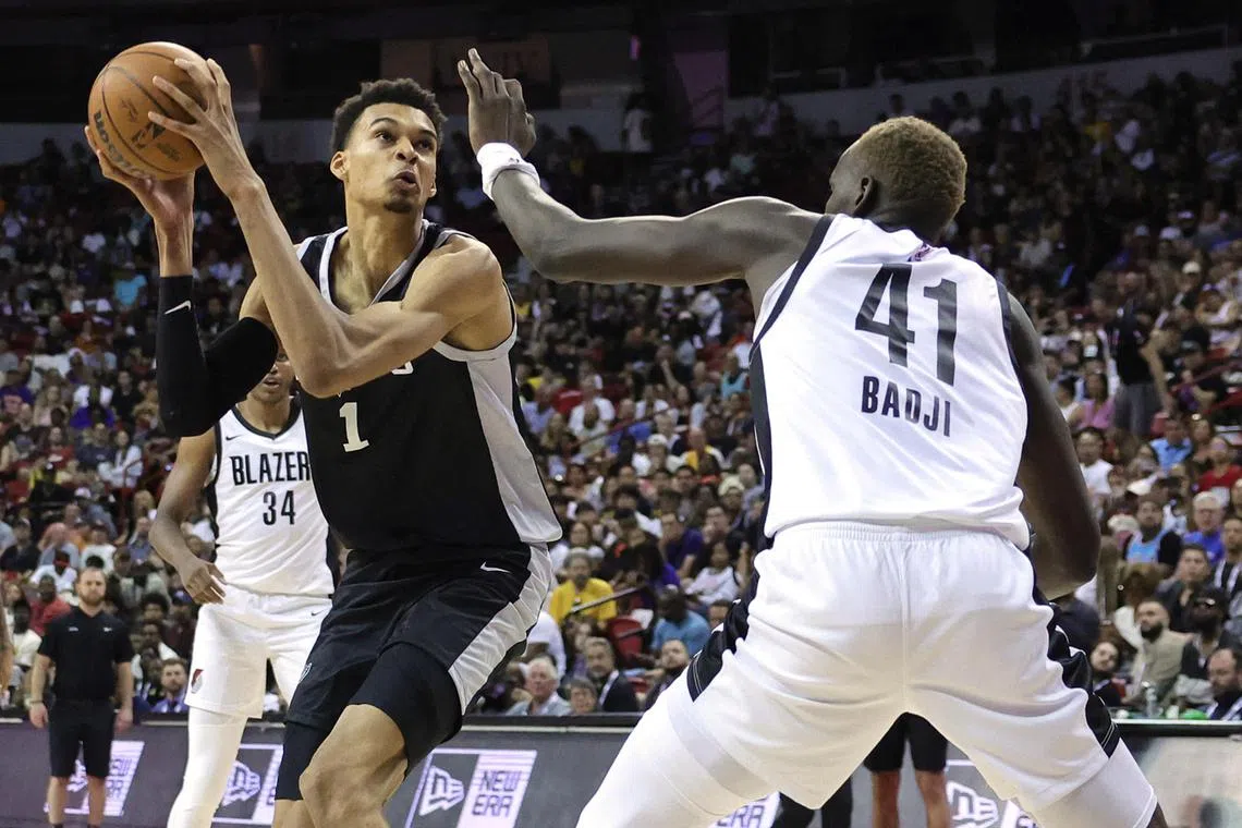 LAS VEGAS, NEVADA - JULY 09: Victor Wembanyama #1 of the San Antonio Spurs looks to shoot against Ibou Badji #41 of the Portland Trail Blazers in the second half of a 2023 NBA Summer League game at the Thomas & Mack Center on July 09, 2023 in Las Vegas, Nevada. NOTE TO USER: User expressly acknowledges and agrees that, by downloading and or using this photograph, User is consenting to the terms and conditions of the Getty Images License Agreement.   Ethan Miller/Getty Images/AFP (Photo by Ethan Miller / GETTY IMAGES NORTH AMERICA / Getty Images via AFP)