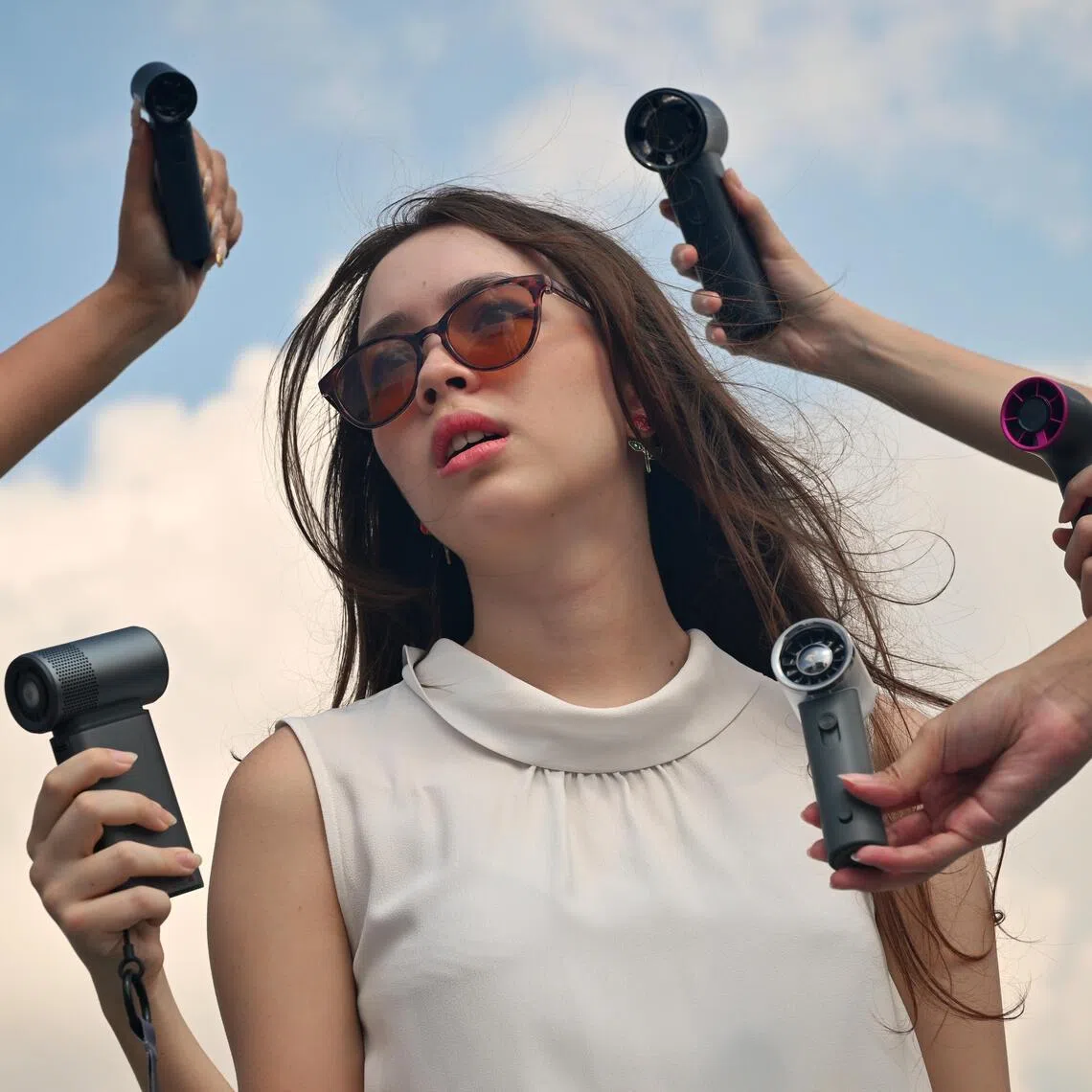 ST20260506_202632800524 Kua Chee Siong/ ssfan11/
The weather is heating up in Singapore and abroad, and with more multi-function handheld fans joining the fray, this article sieves out how best to choose the right one for consumers. 

 A review of seven handheld fans that come with unique functions like atomisers and cooling plates, or tout efficient cooling systems with low noise levels.
