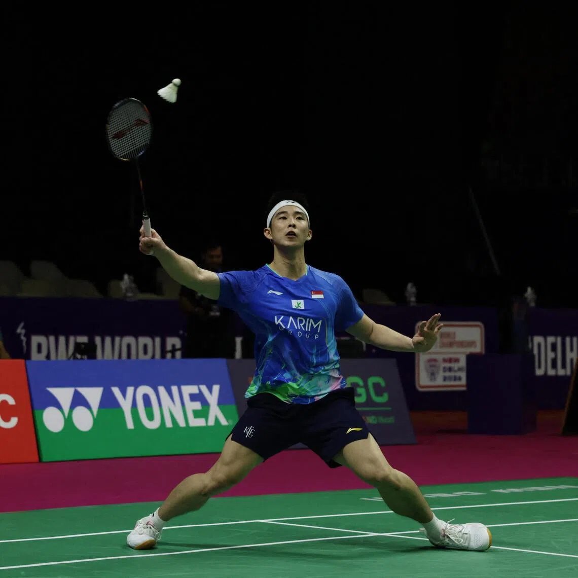 Singapore’s Loh Kean Yew hitting a return during his 15-21, 21-17, 21-15 win over Lee Cheuk Yiu of Hong Kong in the BWF World Championships in New Delhi on Aug 19.
