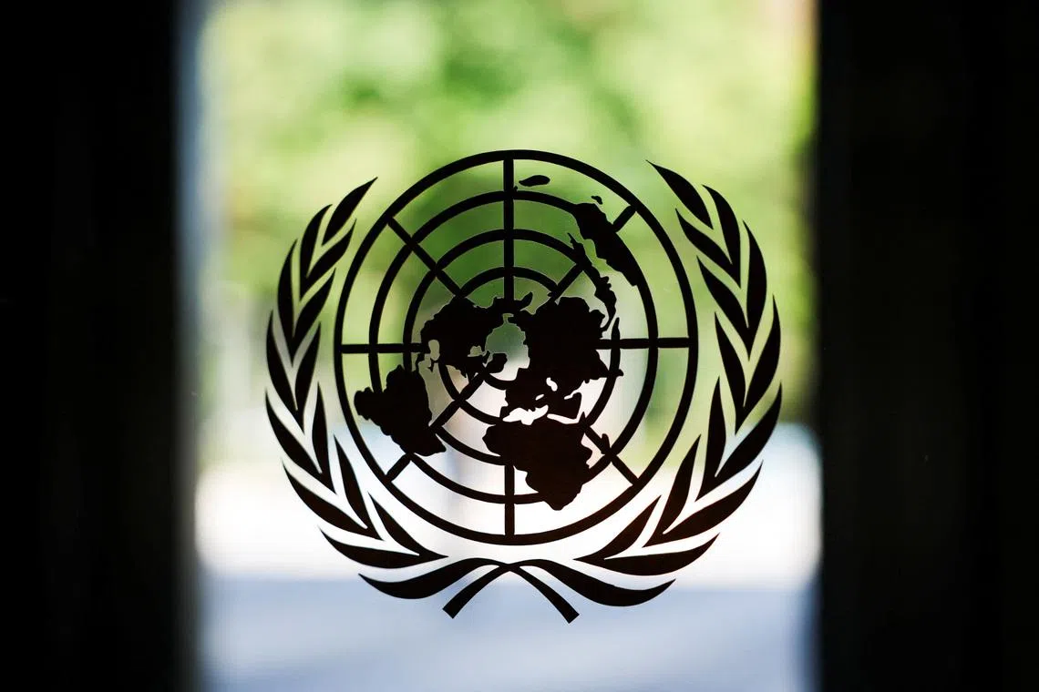 FILE PHOTO: The United Nations logo adorns a window at U.N. headquarters in New York City, U.S., September 18, 2025. REUTERS/Jeenah Moon/File Photo