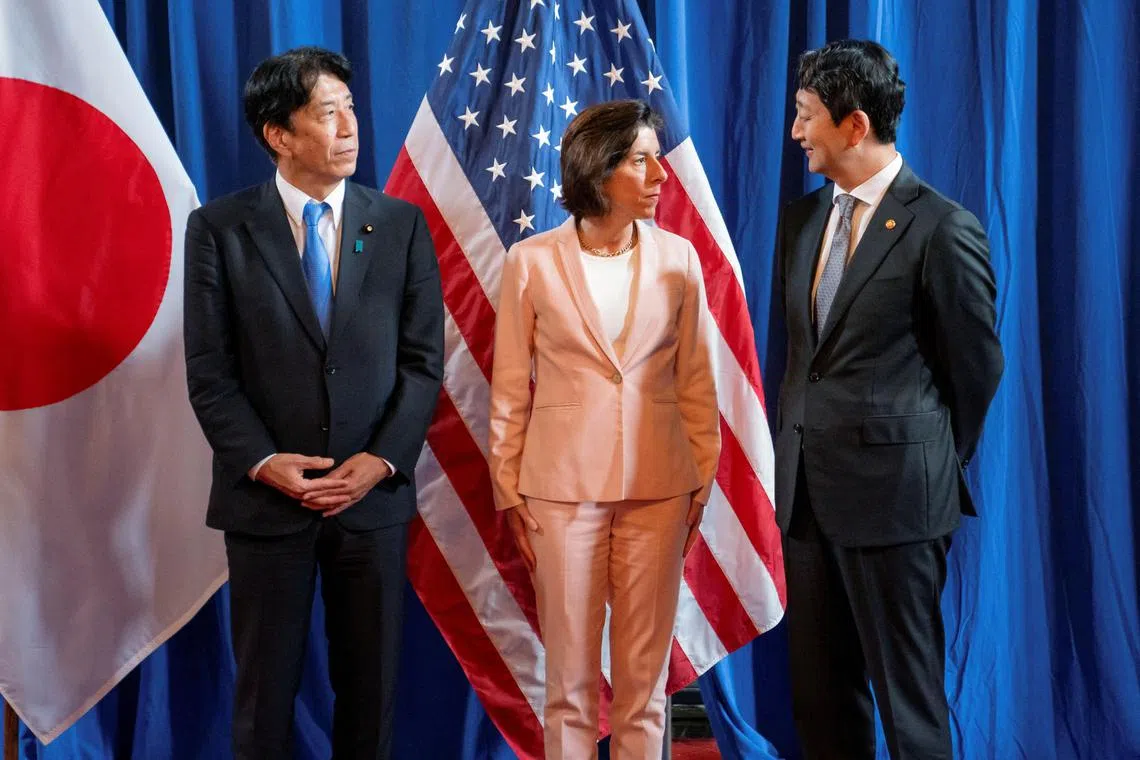 Japan’s Economy, Trade and Industry Minister Ken Saito, US Commerce Secretary Gina Raimondo and South Korea’s Minister of Trade, Industry and Energy Ahn Duk-geun at a meeting in Washington on June 26.