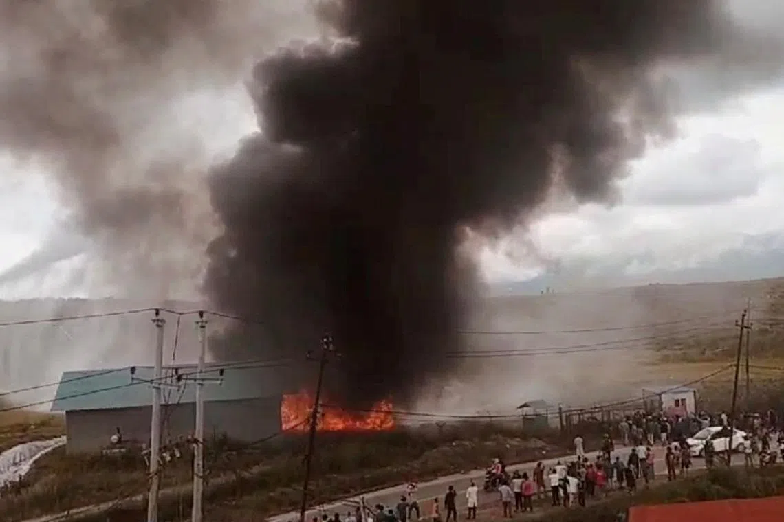 A view shows the aftermath of a plane crash in Kathmandu, Nepal, July 24, 2024, in this screen grab obtained from a social media video. Samjhana Basnet/via REUTERS/File Photo