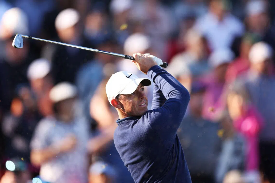 Rory McIlroy plays his shot from the 17th tee during the continuation of the weather delayed second round.