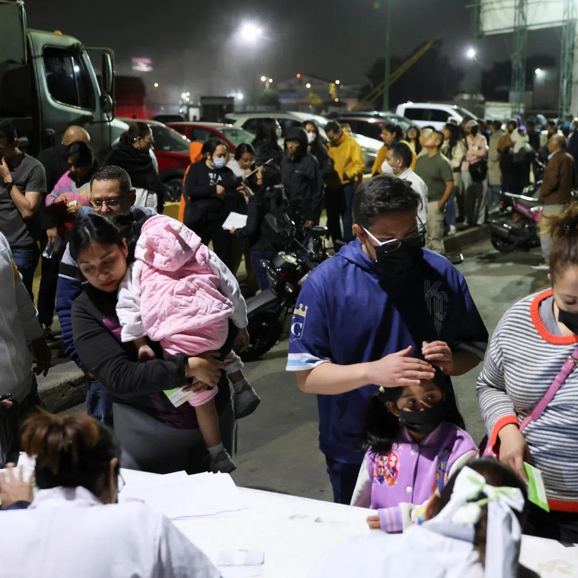 People queue to receive the measles vaccine at the Central de Abasto wholesale market, as health authorities in Mexico launch vaccination campaigns to curb a surge in cases and prevent wider regional transmission, in Mexico City, Mexico, February 11, 2026. REUTERS/Luis Cortes