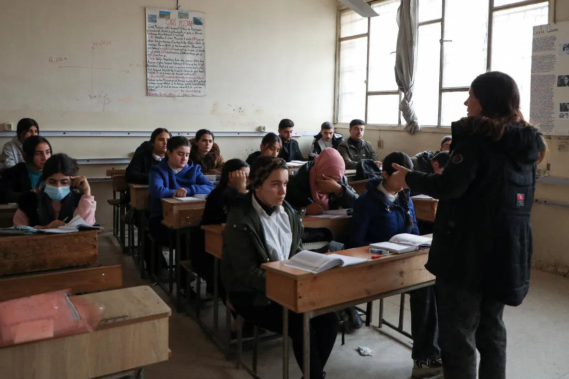 FILE PHOTO: Students attend a class at a school in Qamishli, Syria, December 16, 2024. REUTERS/Orhan Qereman/File Photo