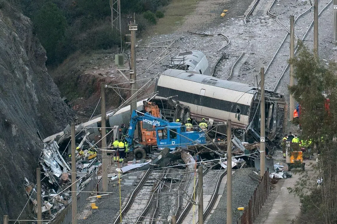 Emergency services and investigators working at the site of the train collision, in Adamuz, southern Spain, on Jan 20.
