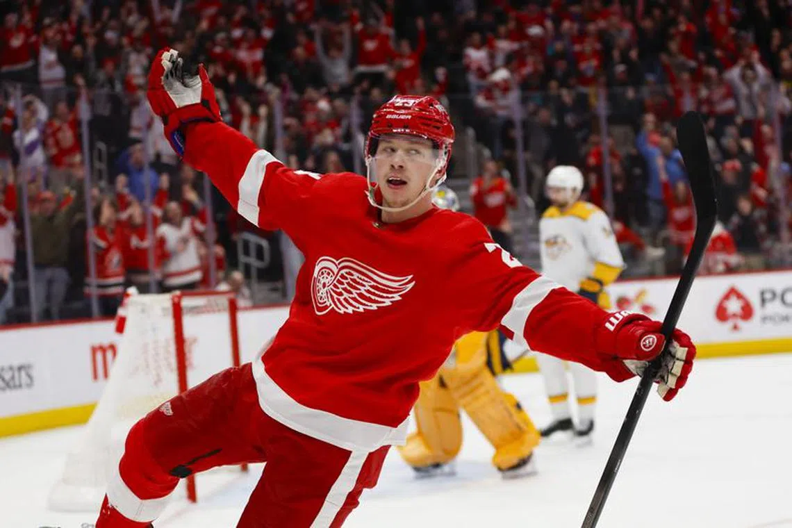 Dec 29, 2023; Detroit, Michigan, USA; Detroit Red Wings left wing Lucas Raymond (23) celebrates his game winning shot during the an overtime period of the game between the Detroit Red Wings and the Nashville Predators at Little Caesars Arena. Mandatory Credit: Brian Bradshaw Sevald-USA TODAY Sports/File Photo
