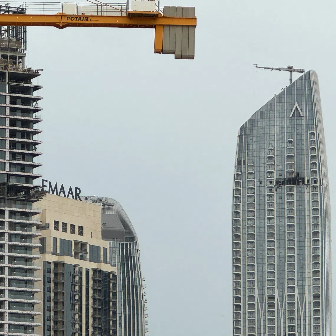 A damaged building in the vicinity of Dubai Creek Harbour after a drone fell on it, amid the U.S.-Israeli conflict with Iran, in Dubai, United Arab Emirates, March 12, 2026. Picture taken with a mobile phone. REUTERS/Stringer