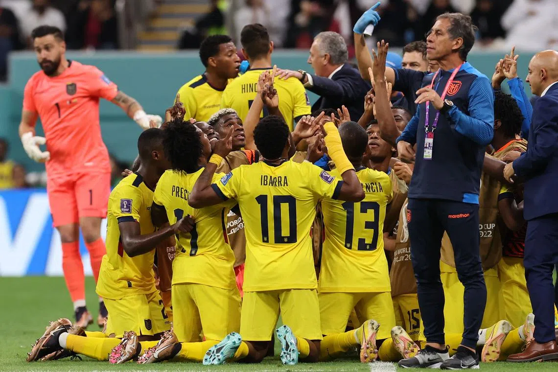 Ecuador's forward Enner Valencia (No. 13) celebrating with teammates after he scored his team's second goal during the 2022 World Cup opener at the Al-Bayt Stadium in Al Khor on Nov 20.