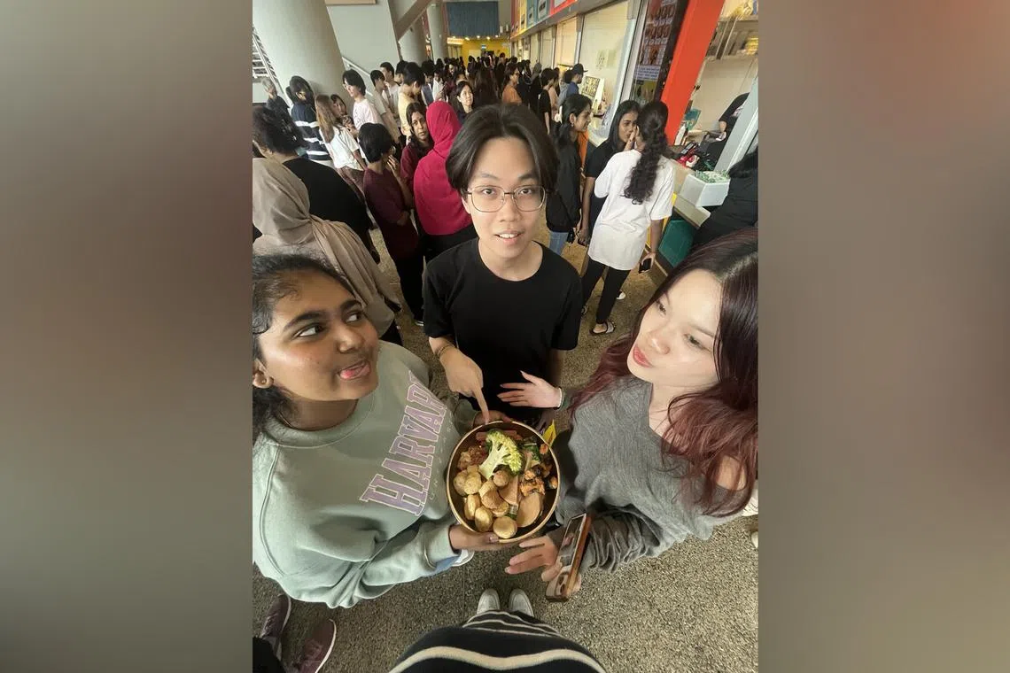Republic Polytechnic (RP) student Shabhreen Bhanoo Mohamed Rafi with her friends at the RP campus' South Food Court during lunch break.