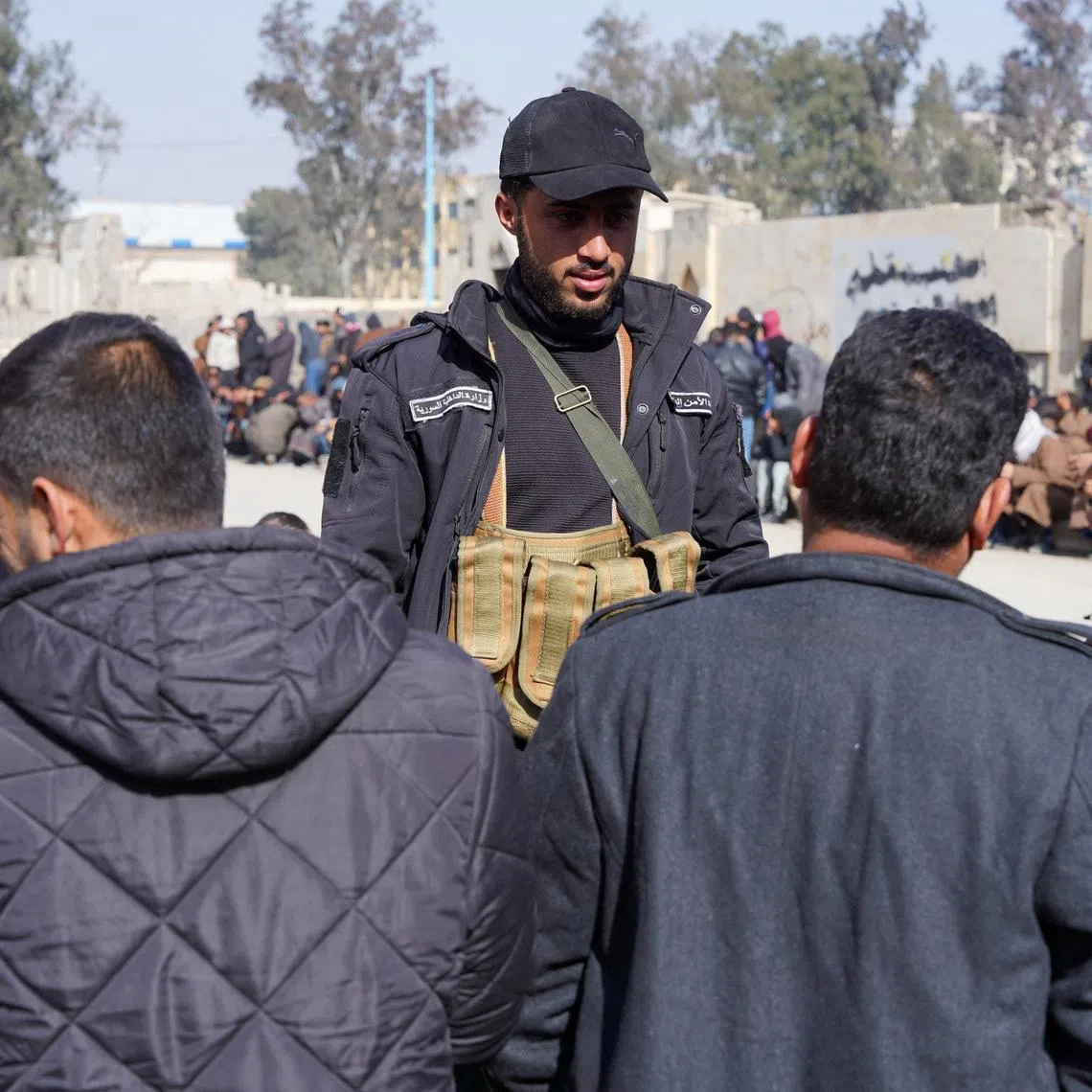Members of the Kurdish-led Syrian Democratic Forces (SDF) queue to settle their status with Syrian government in Raqqa, Syria January 27, 2026. REUTERS/Karam al-Masri