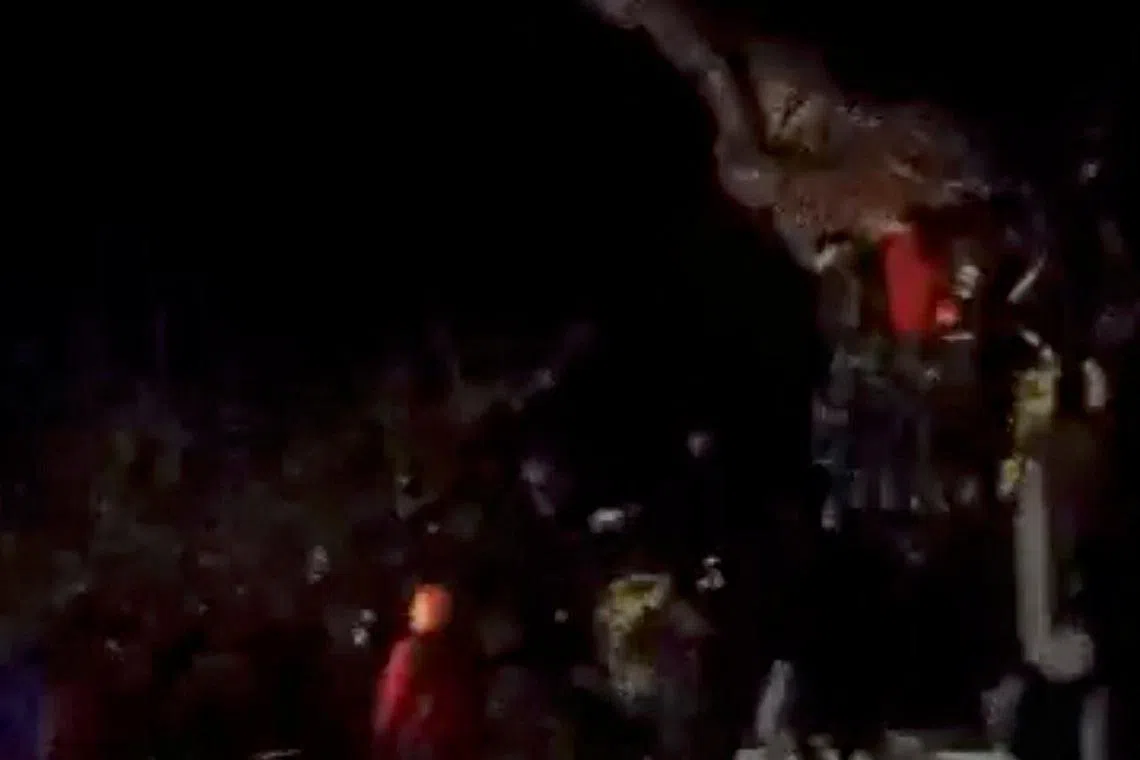People demolish the statue of former President of Syria Hafez al-Assad, Syrian President Bashar al-Assad's father, in Daraa, as Syrian rebels said they seized control of the southern city of Daraa, Syria, in this screengrab obtained from a social media video released on December 7, 2024. Social Media via REUTERS