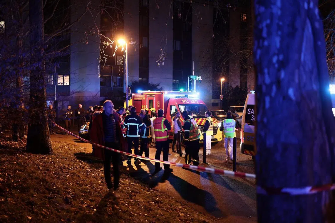 Emergency services work near the scene of an explosion at a bar where a grenade was thrown, in Grenoble, on February 12, 2025. At least nine people were injured, one seriously, after an explosion, possibly of criminal origin, in a bar in Grenoble on February 12, 2025. The explosion took place shortly after 8pm emergency services told AFP. A source close to the case mentioned a possible malicious act that could be due to a grenade. (Photo by Maxime GRUSS / AFP)