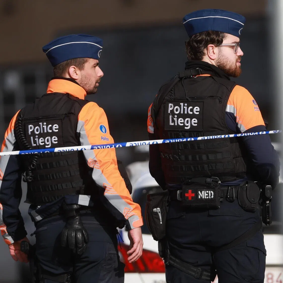 Police officers secure the area outside a synagogue after an explosion in Liege, Belgium, on March 9.