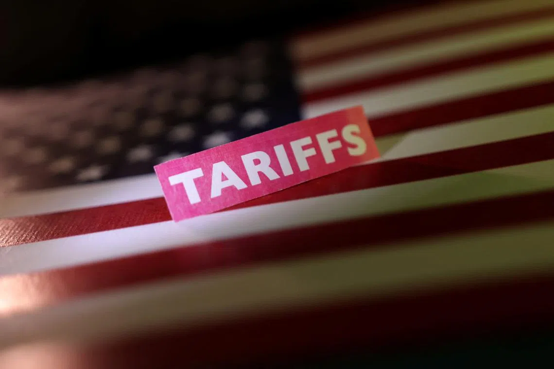 FILE PHOTO: A U.S. flag and a "tariffs" label are seen in this illustration taken April 10, 2025. REUTERS/Dado Ruvic/Illustration/File Photo