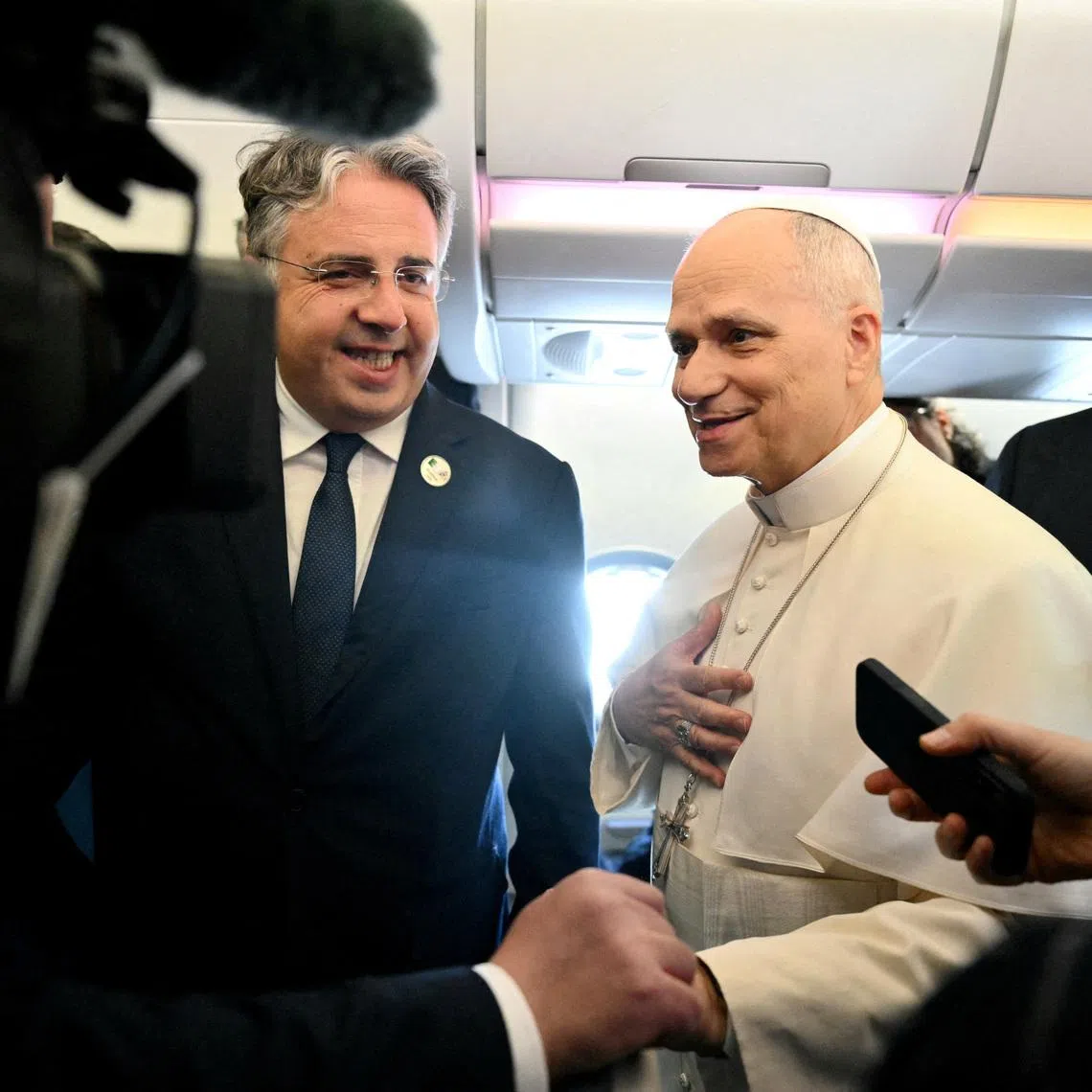 Pope Leo XIV addresses journalists during the flight heading to Algiers on April 13, 2026. Pope Leo XIV embarks today on an 11-day visit to Algeria, Cameroon, Angola and Equatorial Guinea for his first major international trip since becoming pontiff last year. ALBERTO PIZZOLI/Pool via REUTERS