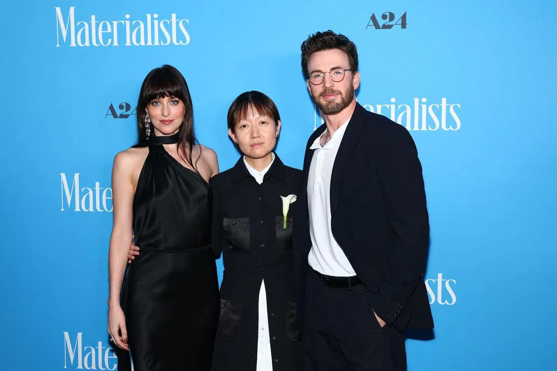 (From left) Dakota Johnson, Celine Song and Chris Evans at the Materialists premiere on June 7, 2025 in New York City.  