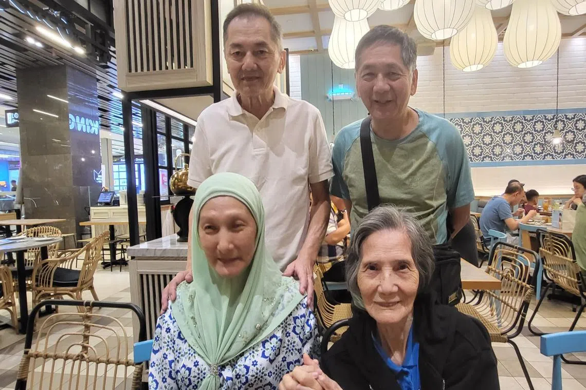 Madam Teng Ek Kiew (front right) with her daughter Hamsiah Mohamad and sons Ling Kok Heng (back left) and Ling Kok Ong in Kuala Lumpur.