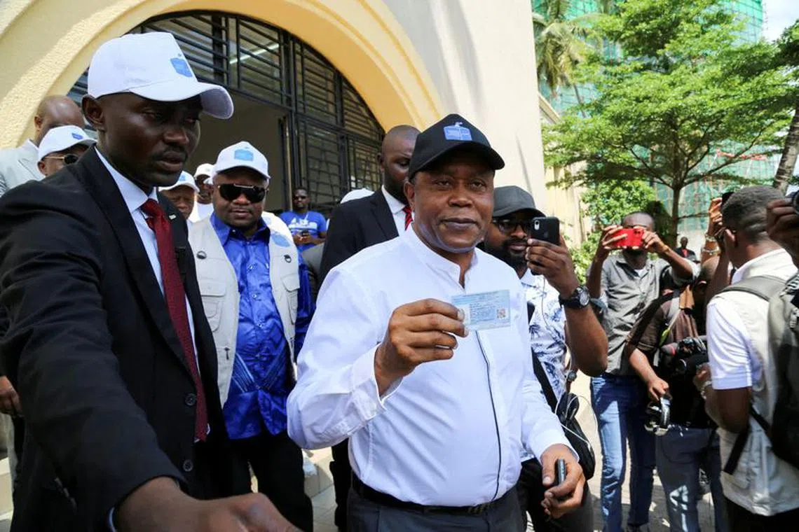 FILE PHOTO: President of the Independent National Electoral Commission (CENI) Denis Kadima, shows his electoral card after his registration process during the launch of the voter registration process for the December 2023 general elections in Kinshasa, Democratic Republic of Congo, December 24, 2022. REUTERS/ Justin Makangara//File Photo