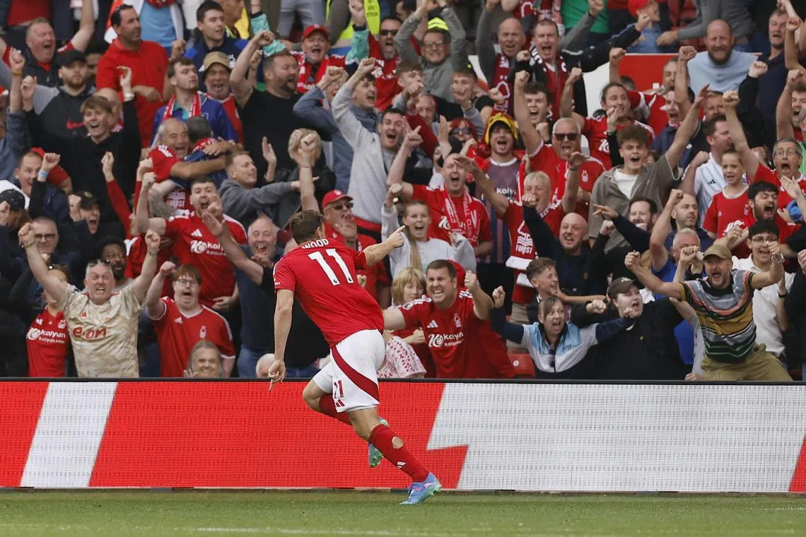 Nottingham Forest' Chris Wood celebrating with fans at the City Ground. The New Zealander is in the form of his life with Forest flying high in third spot.