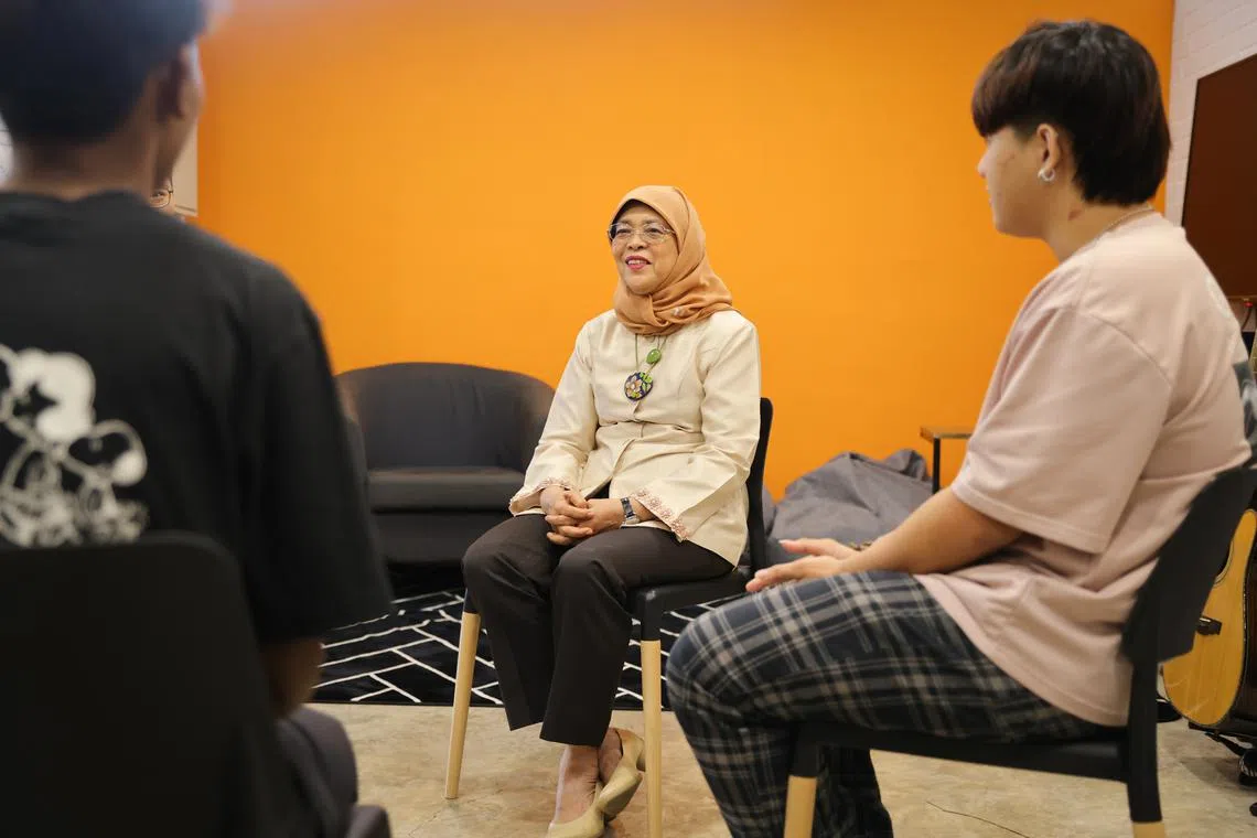 President Halimah Yacob speaking to staff members and youths at Care Corner Youth Services, on May 31.