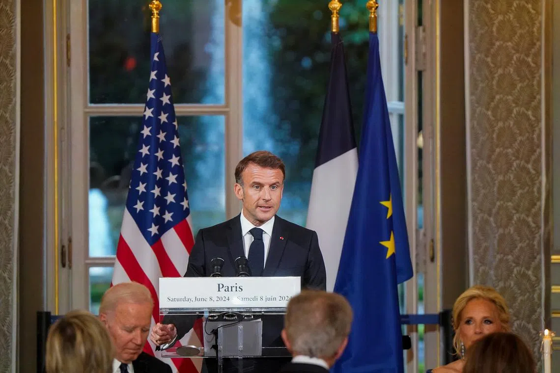 French President Emmanuel Macron speaks at a state dinner held in honor of U.S. President Joe Biden and first Lady Jill Biden, at the Elysee Palace, in Paris, France  June 8, 2024. REUTERS/Elizabeth Frantz