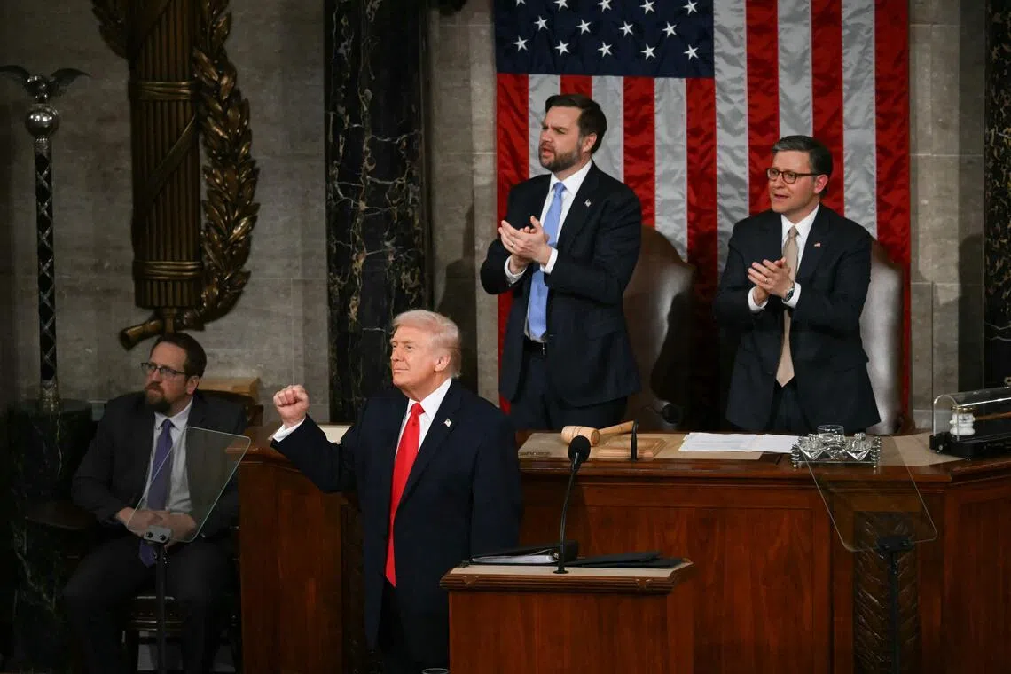 US President Donald Trump stands and gestures during the State of the Union address in the House Chamber of the US Capitol in Washington, DC, on Feb 24.