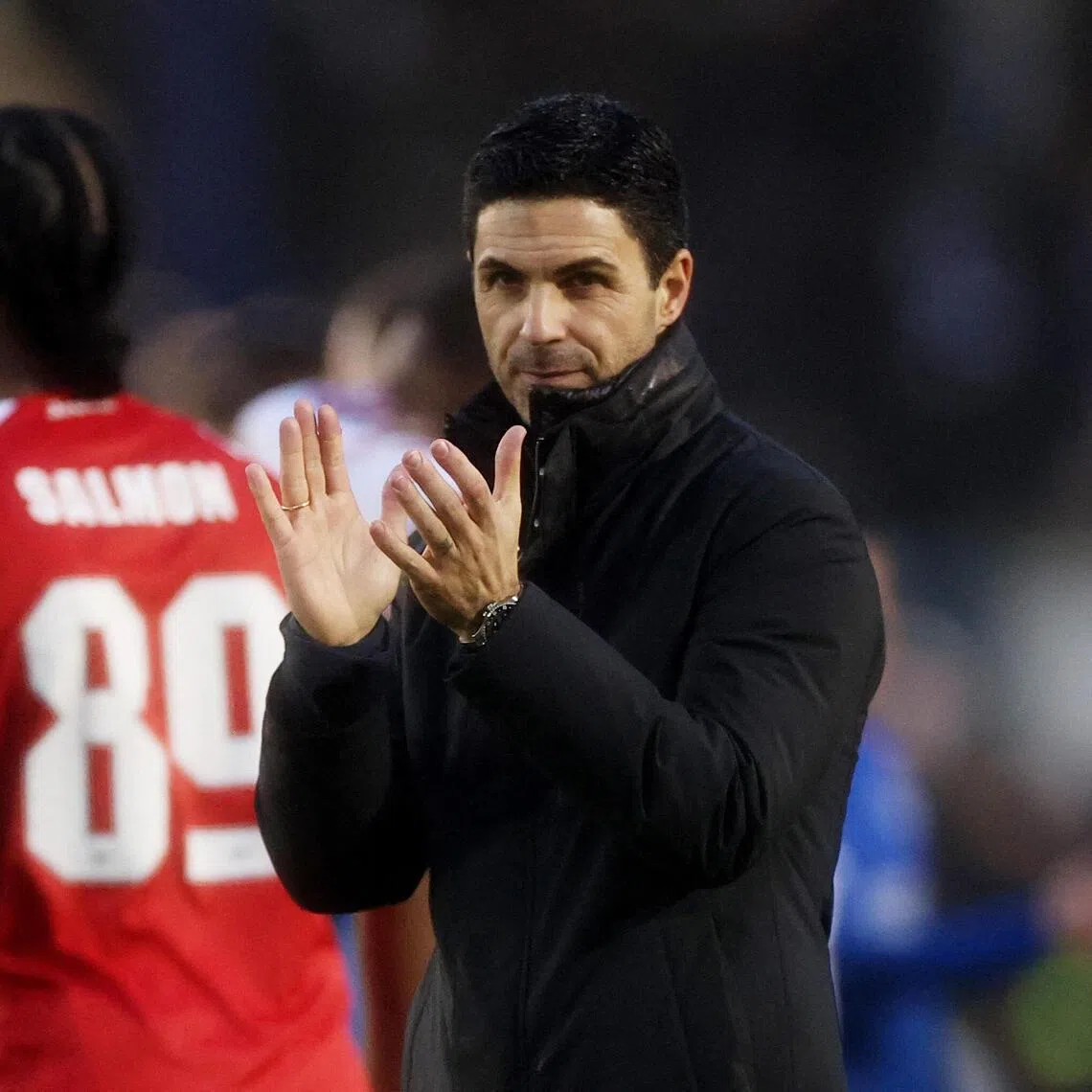 Arsenal manager Mikel Arteta applauds fans after the FA Cup win over Portsmouth.