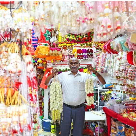 (Clockwise from top left) Mr R. Jayaselvam of Anushia Flower Shop, Sung Yuen Ling and her father of Maha Yu Yi, Ms Fauzia Rani and her father of VSS Varusai Mohamed & Sons, and Mr Haffidz Abdul Hamid of Halijah Travels.