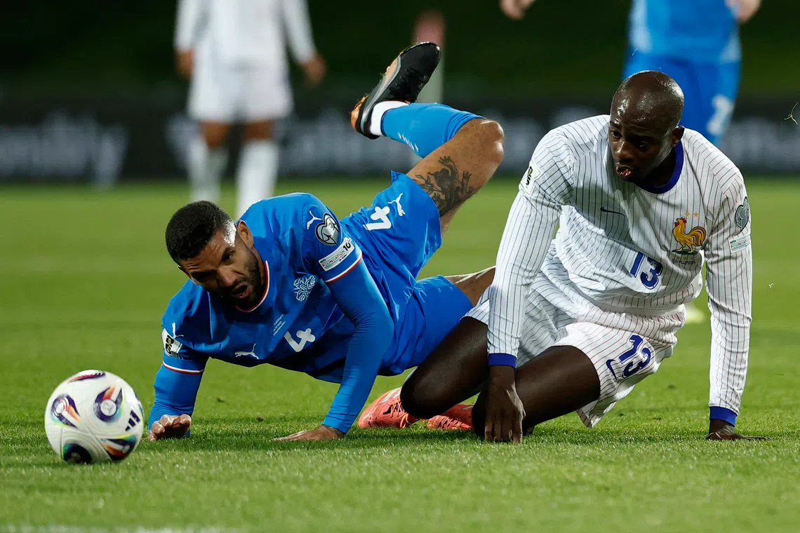 Soccer Football - FIFA World Cup - UEFA Qualifiers - Group D - Iceland v France - Laugardalsvollur, Reykjavik, Iceland - October 13, 2025 Iceland's Victor Palsson in action with France's Jean-Philippe Mateta REUTERS/Benoit Tessier