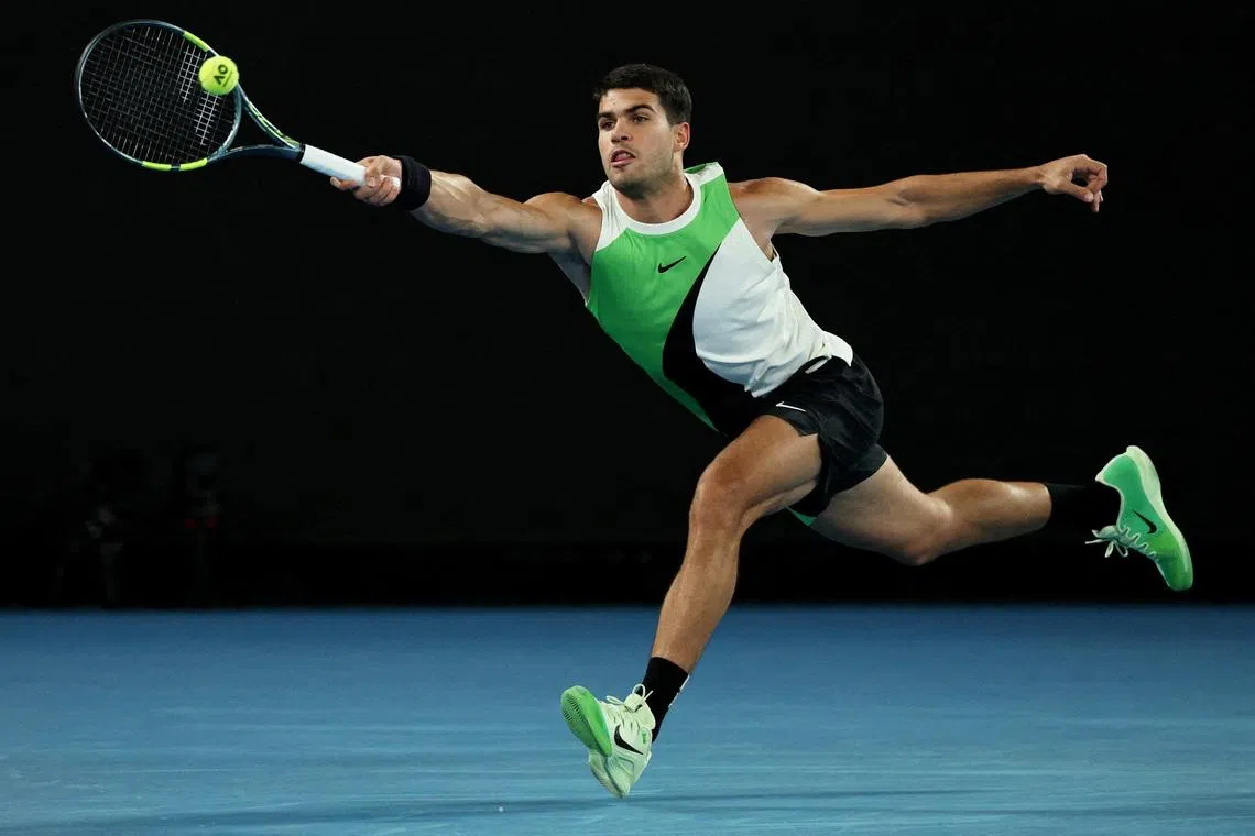 Tennis - Australian Open - Melbourne Park, Melbourne, Australia - January 18, 2026 Spain's Carlos Alcaraz in action during his first round match against Australia's Adam Walton REUTERS/Hollie Adams
