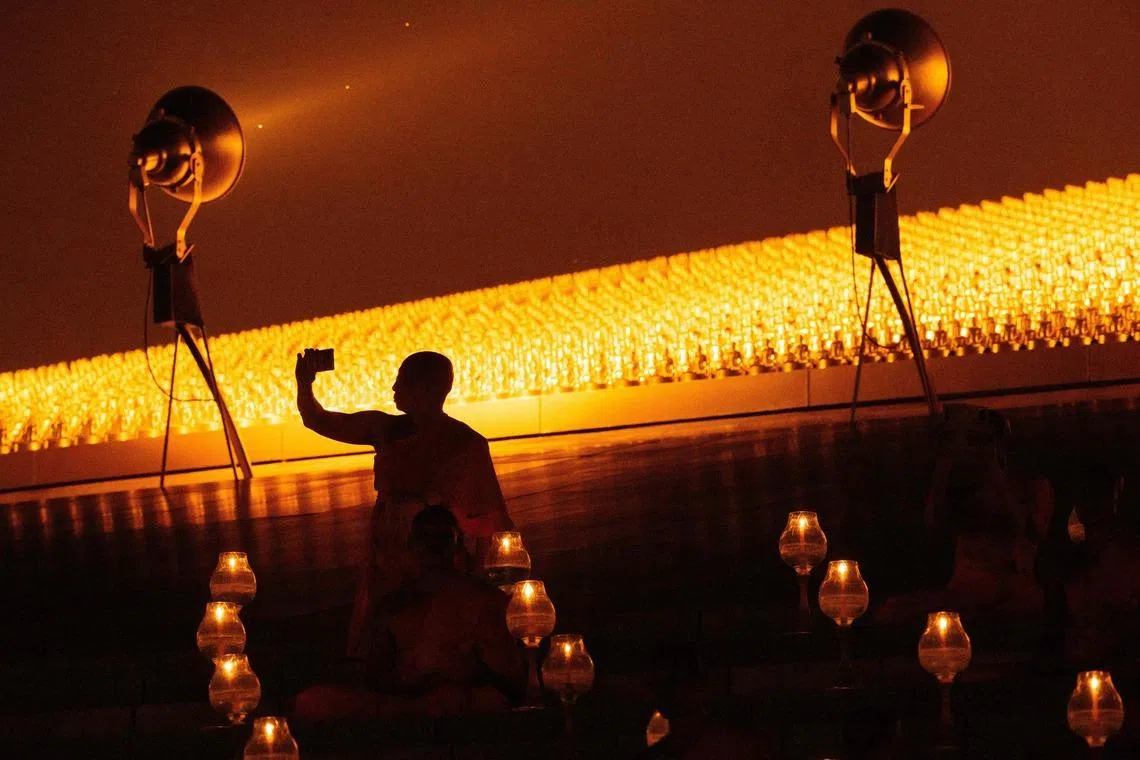 Buddhist monks taking part in Makha Bucha celebrations at Wat Dhammakaya Buddhist temple in Pathum Thani province, north of Bangkok, on March 3, 2026. 