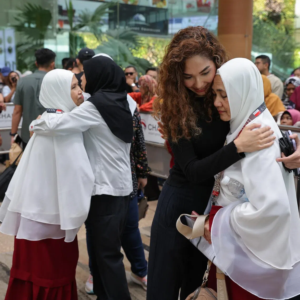 Relatives and friends at Changi Airport sending off the haj pilgrims.
