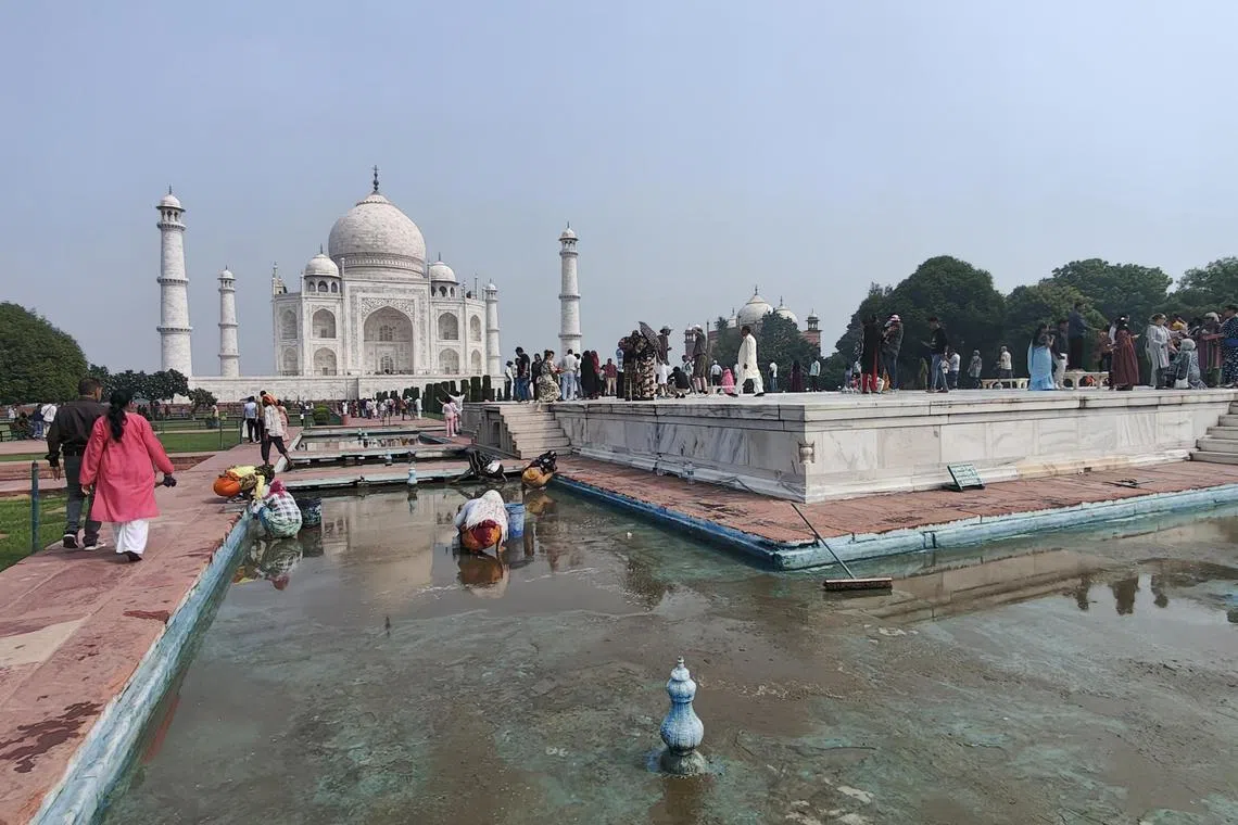 ddtajmahal - Workers cleaning one of the fountains at Taj Mahal on September 24.

ST Photo: Debarshi Dasgupta