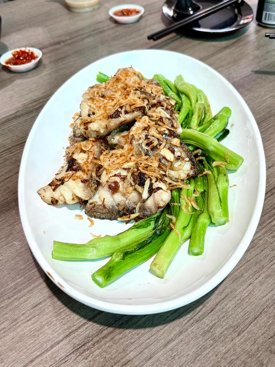 Chef Chik’s Giant Grouper Medallions with Sakura Shrimp and Olive.
