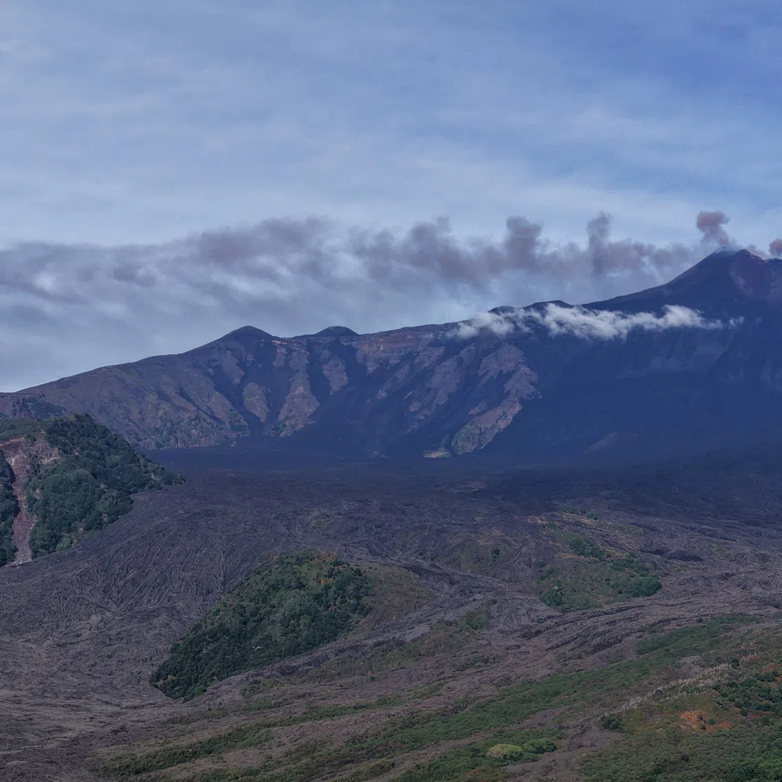 A view shows volcanic ash and fumes rising during an eruption at Mount Etna, as seen from Milo, Sicily, Italy, September 14, 2026. Giuseppe Di Stefano/Etna Walk/Handout via REUTERS